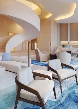 Interior image of the Spa at the Conrad Orlando lobby area with minimalist chairs and spiral staircase