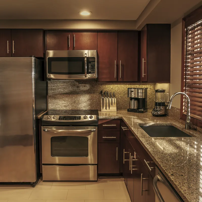 Villas kitchen interior with marble countertops and stainless steel appliances