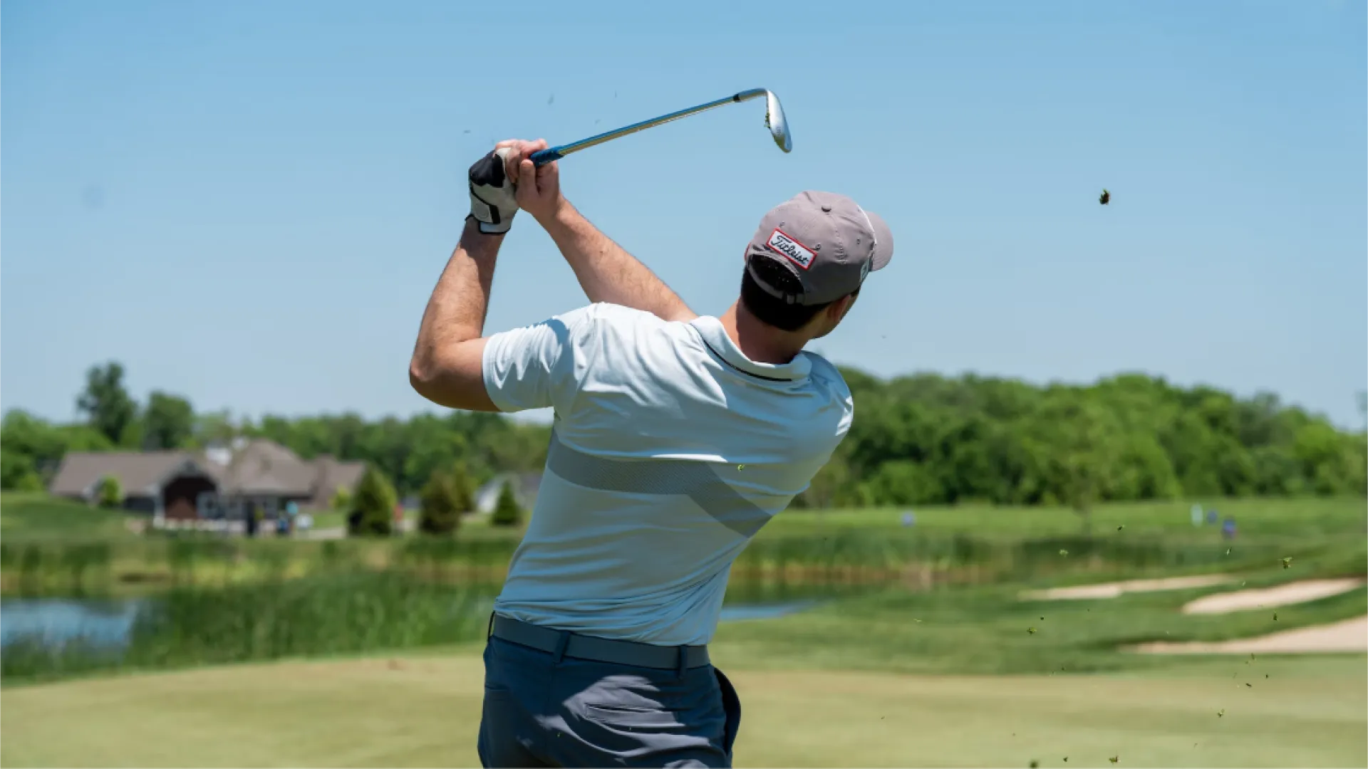 Golfer mid-swing on Grand Cypress Golf course