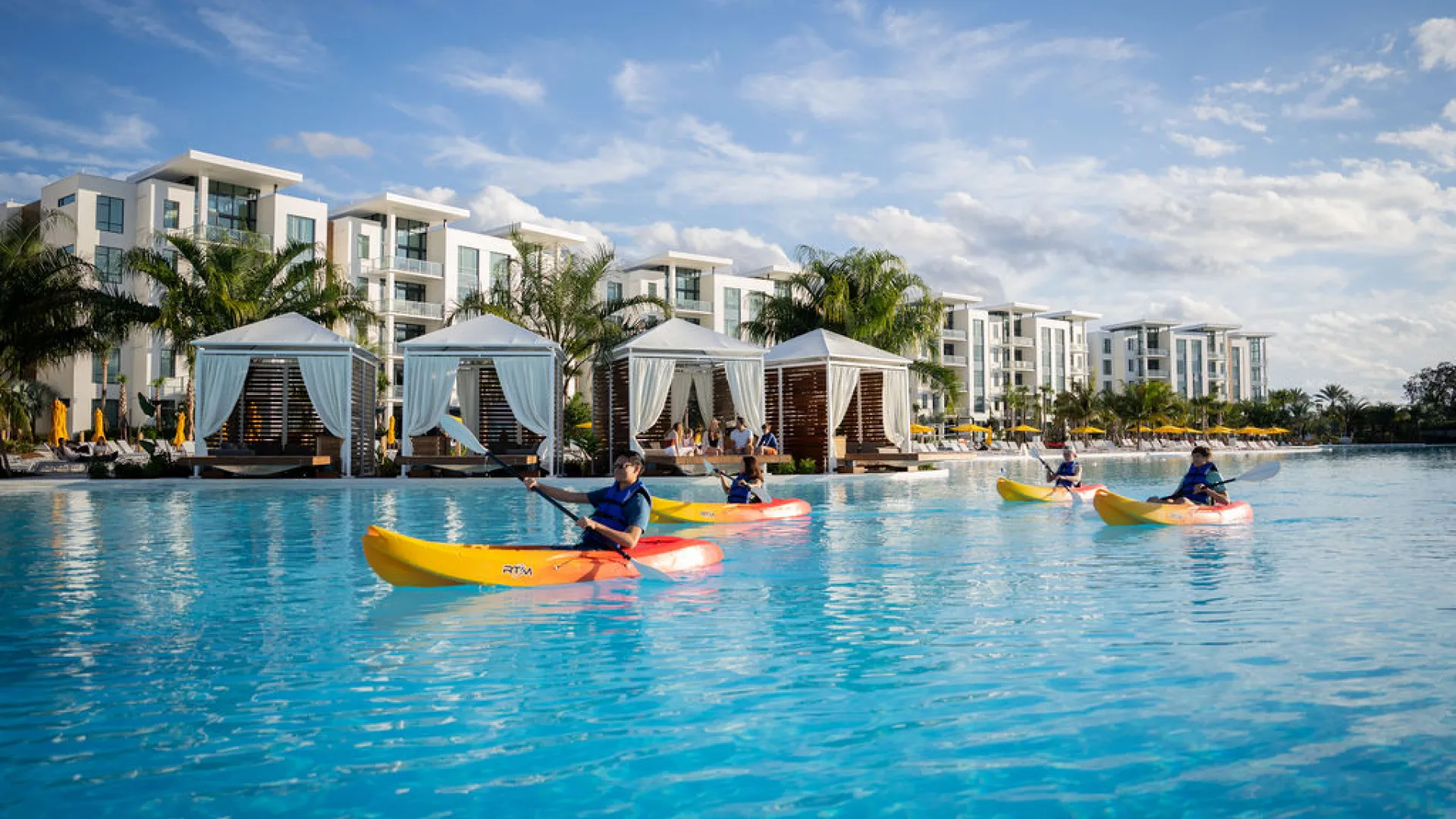 An image of kayakers in Evermore Bay with a view Evermore Flats and Private Cabanas.
