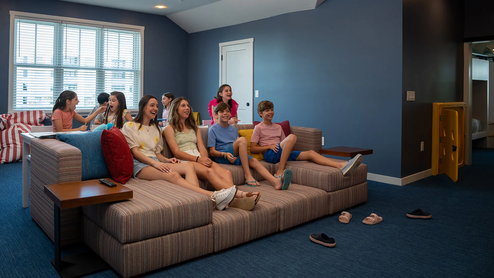 An image of kids enjoying lounge area in an Evermore House.