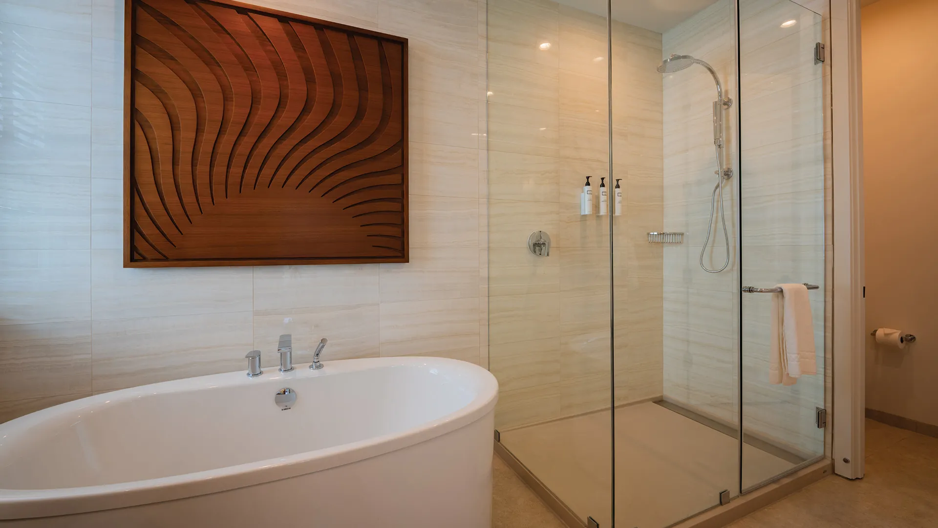 An image of a primary bathroom with a bathtub and walk-in shower in an Evermore House.