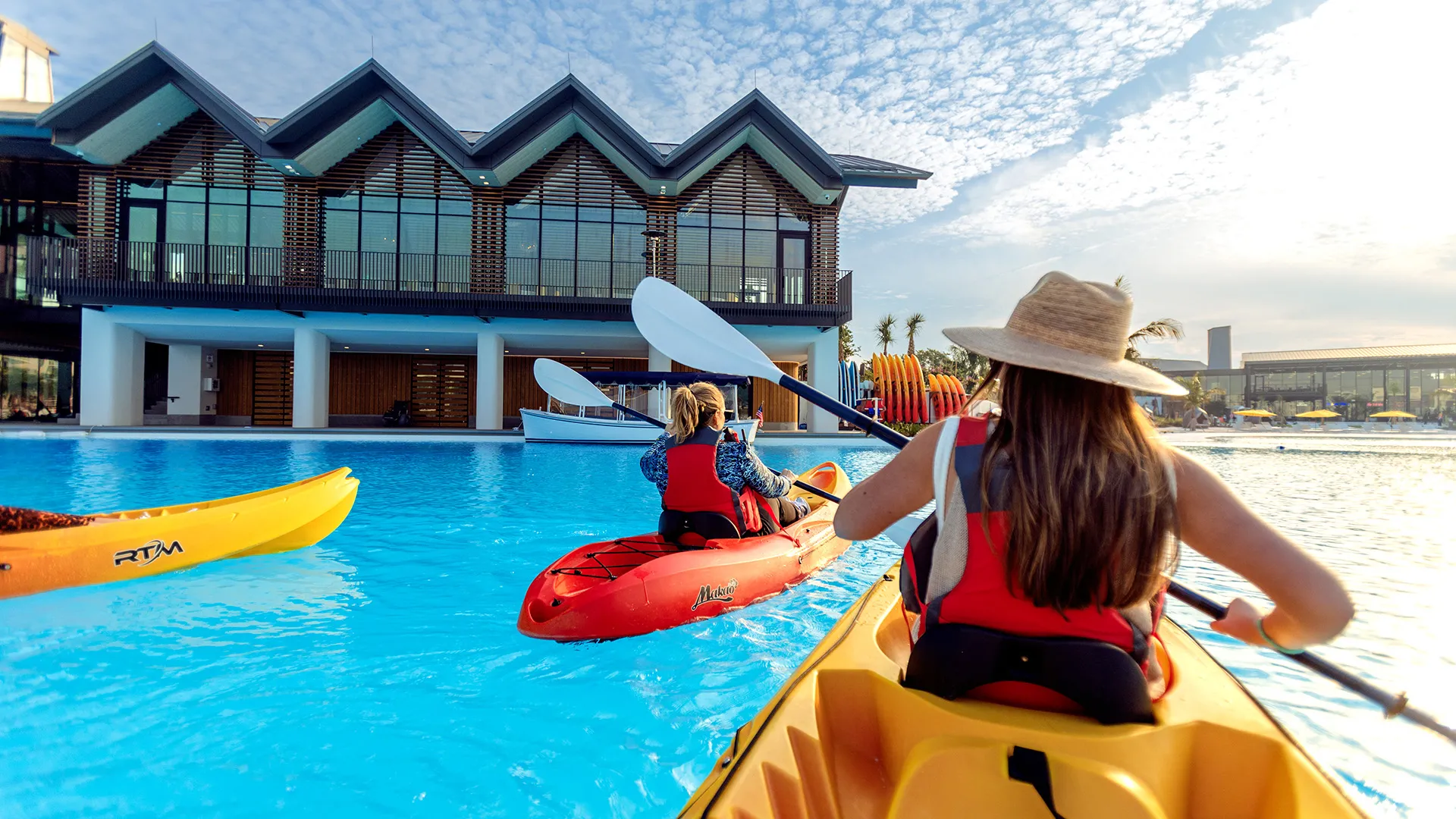 Kayaking on Evermore Bay Image of guests kayaking together on Evermore Bay by The Boathouse at Evermore Orlando Resort.