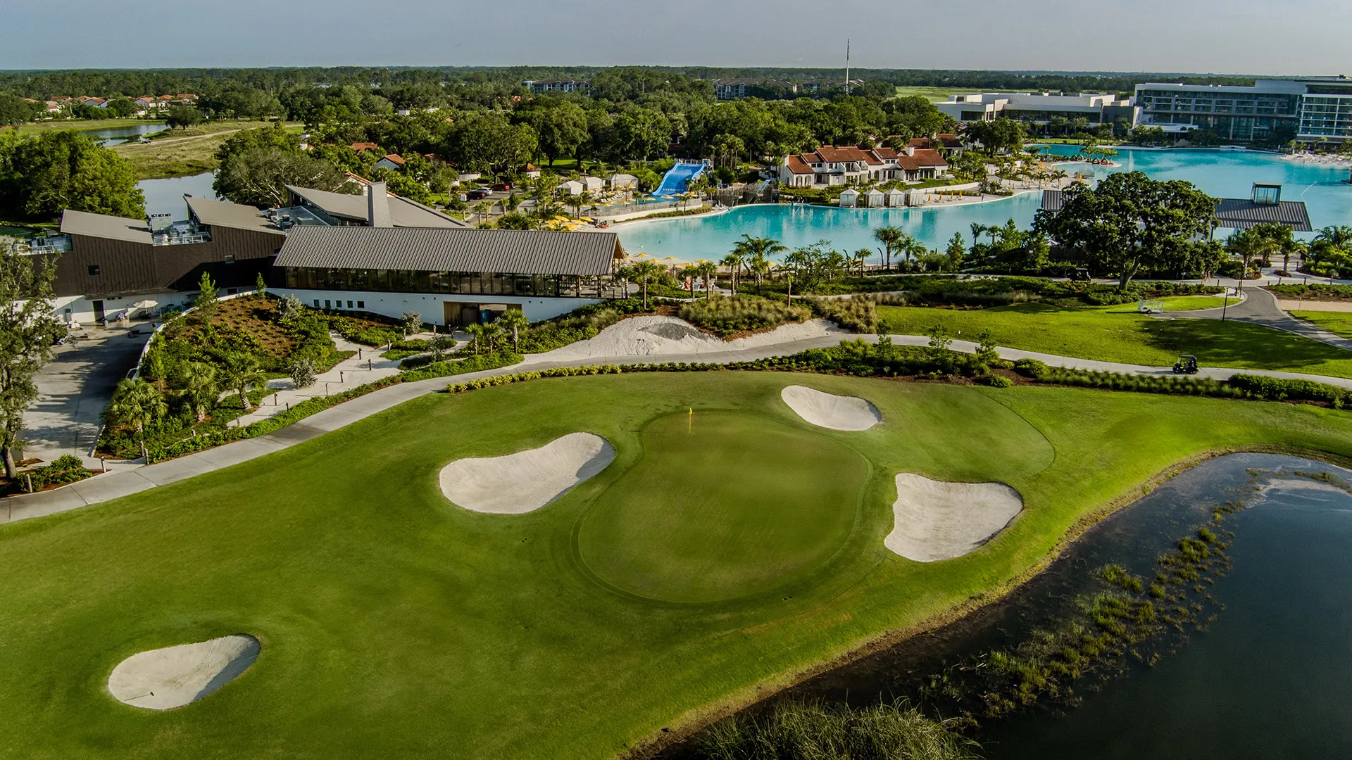 Image of the 18th hole of the Grand Cypress Golf Cypress Course with Evermore Bay in the background at Evermore Orlando Resort.