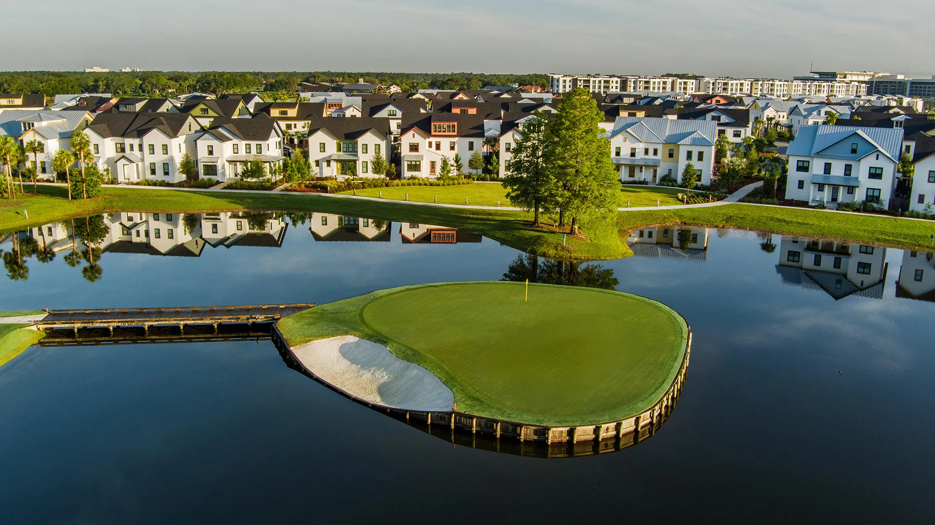 Image of the par-3 island green on hole 3 of the Grand Cypress Golf Cypress Course near private vacation homes at Evermore Orlando Resort.