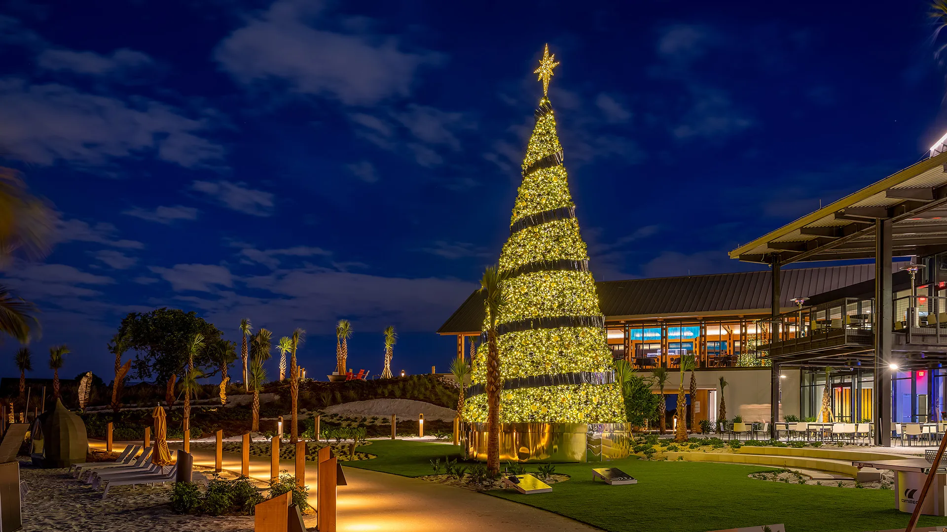 Image of The Landing Lawn decorated for the holidays at Evermore Orlando Resort.