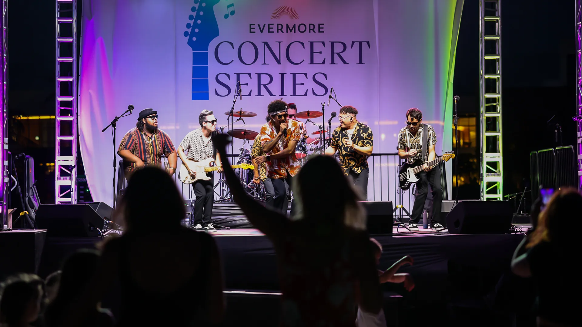Image of guests dancing on the beach while enjoying live music during the Evermore Concert Series at Evermore Orlando Resort.