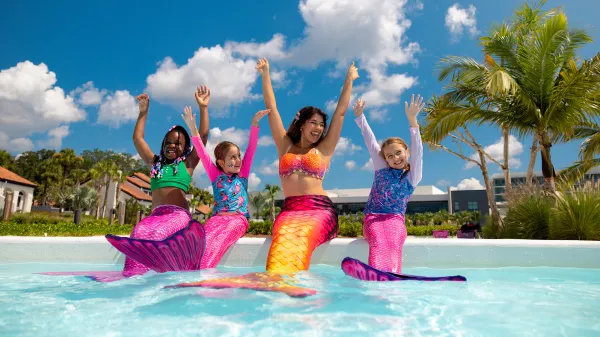 An image of kids playing with a mermaid in Evermore Bay.