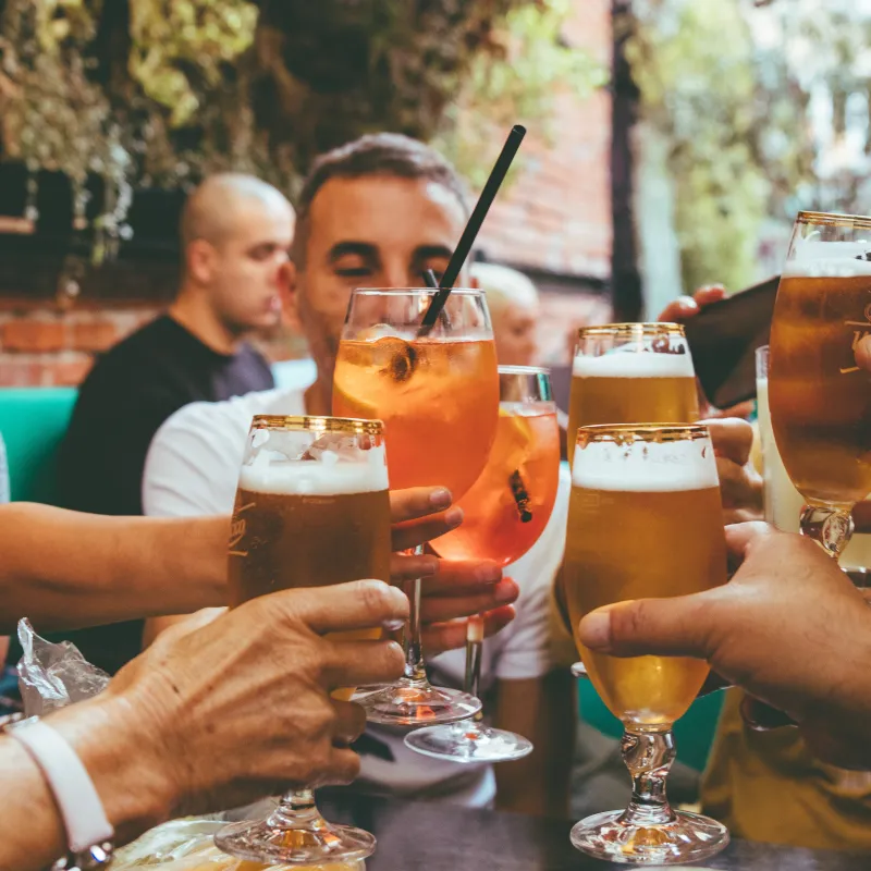 Group of friends cheersing beverage glasses