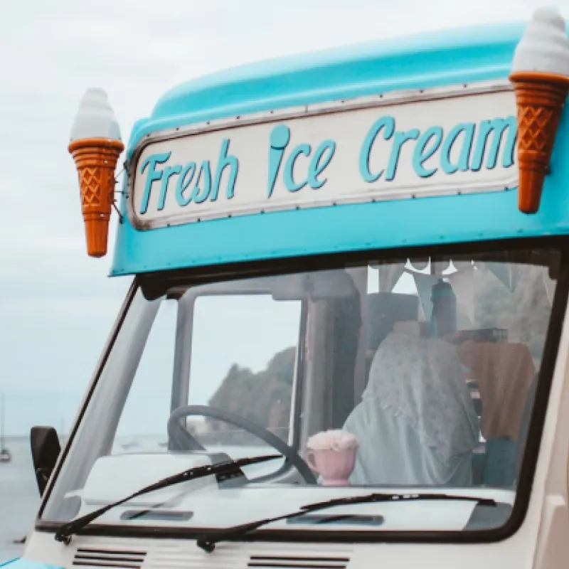 Ice Cream Brigade Close up of Ice Cream truck with sign reading Fresh Ice Cream