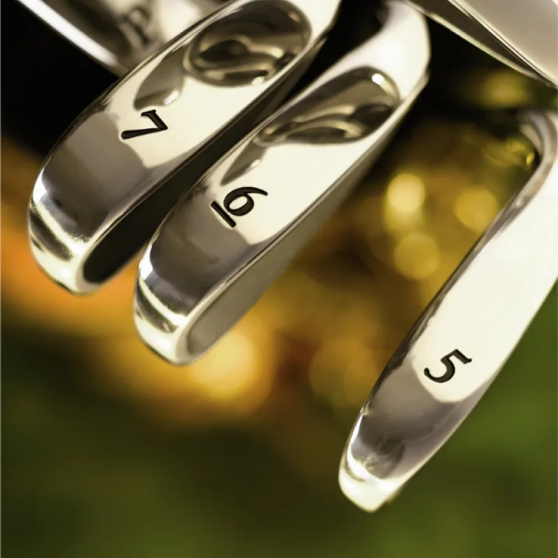 Close up shot of golf clubs with labels 7, 6, 5