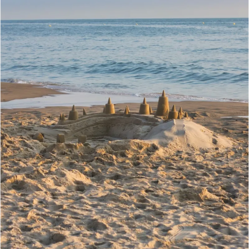 Sandcastles on the Shore Crafted Sandcastles on the Shore of the Beach
