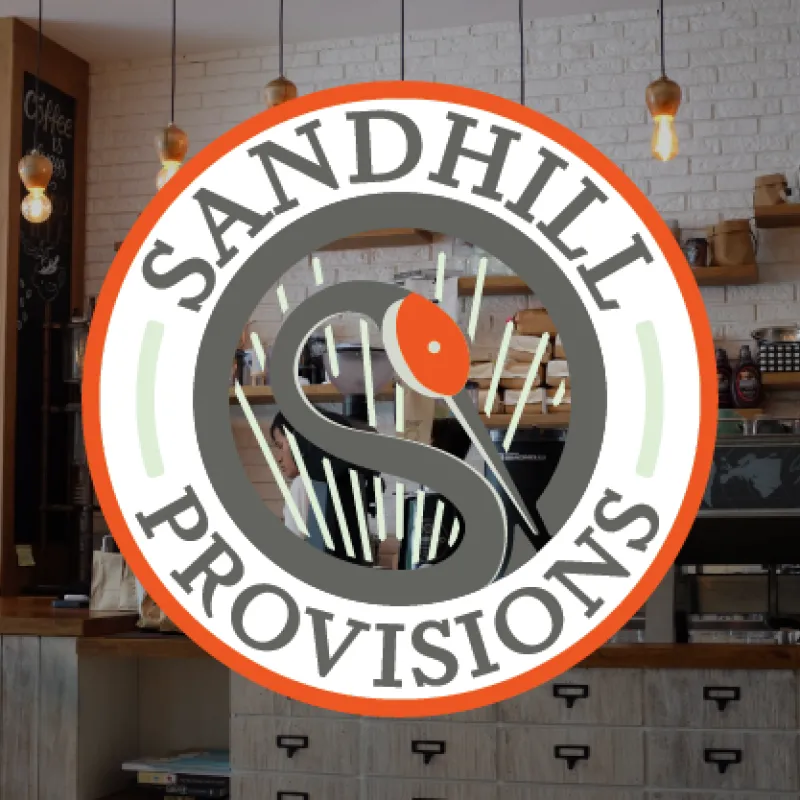 Interior image of Sandhill Provisions cafe with Sandhill Provisions logo overlayed