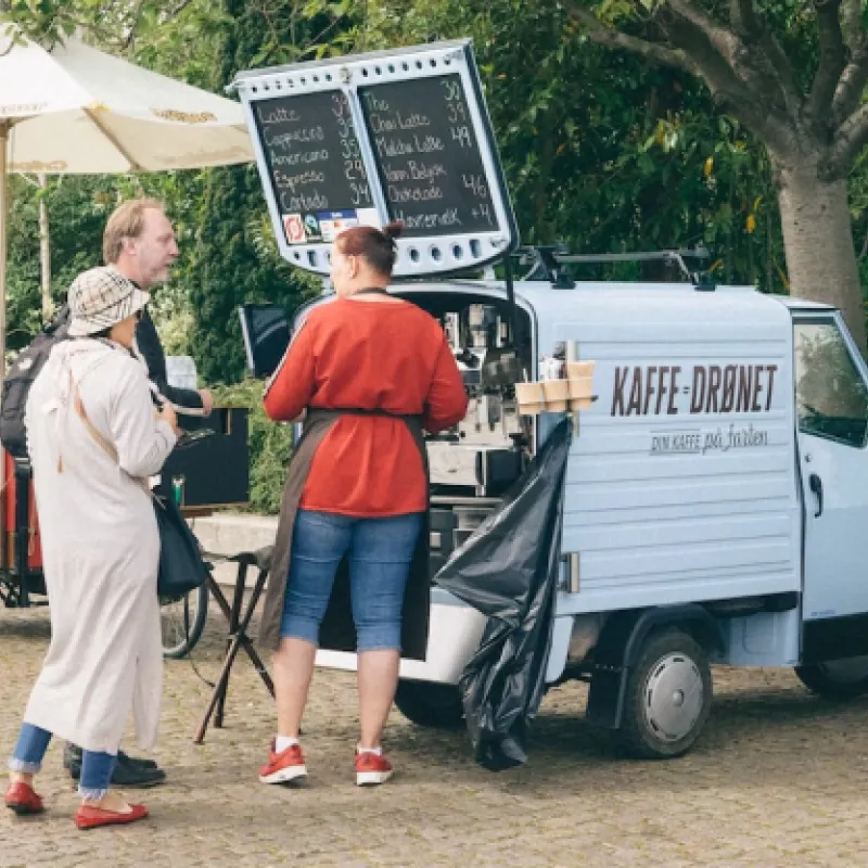 Deja Brew Coffee Cart with guests ordering from vendor