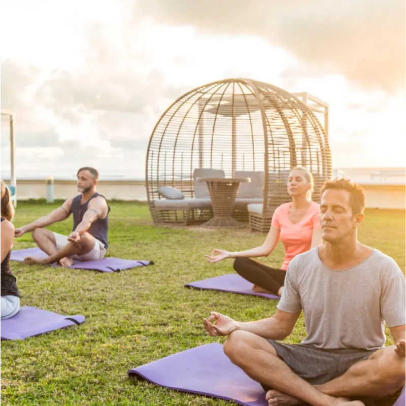 Sunset Yoga Guests enjoying yoga outdoors at sunset