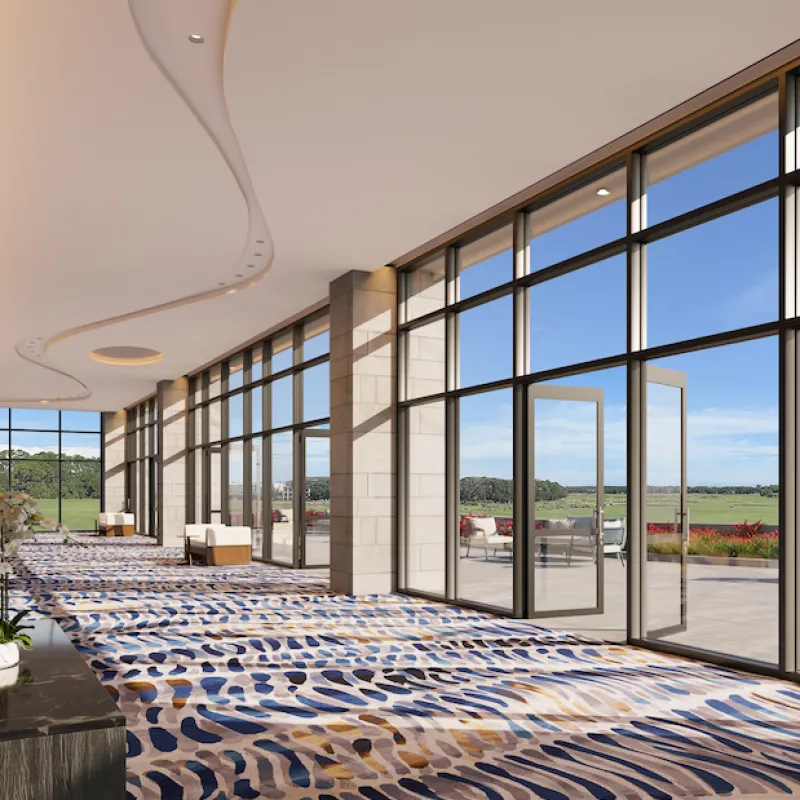 Conrad Orlando Jacaranda Terrace Thumbnail Interior shot of Conrad Jacaranda Terrace with glass doors ajar overlooking site greenery