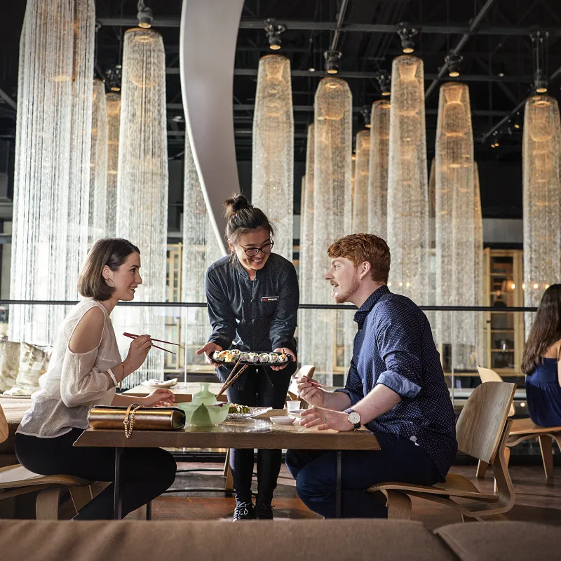 An image of a couple dinning at Morimoto at Disney Springs
