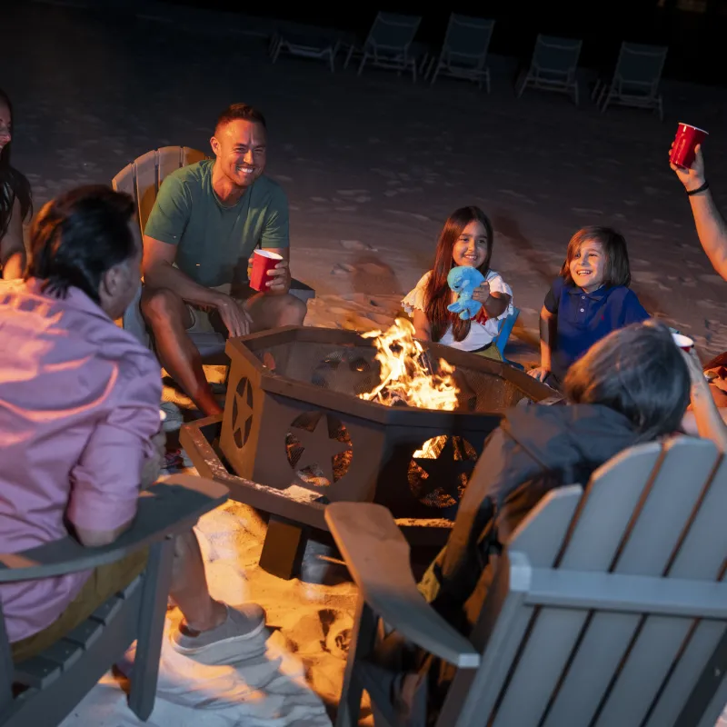 Family gathered around a firepit