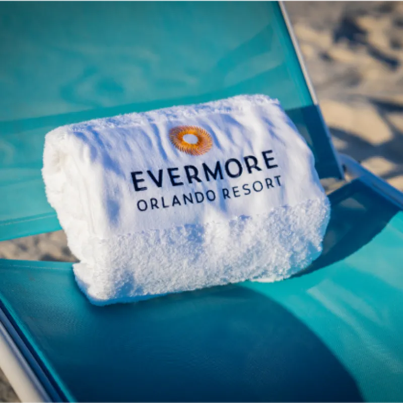Towel sitting on blue outdoor seating