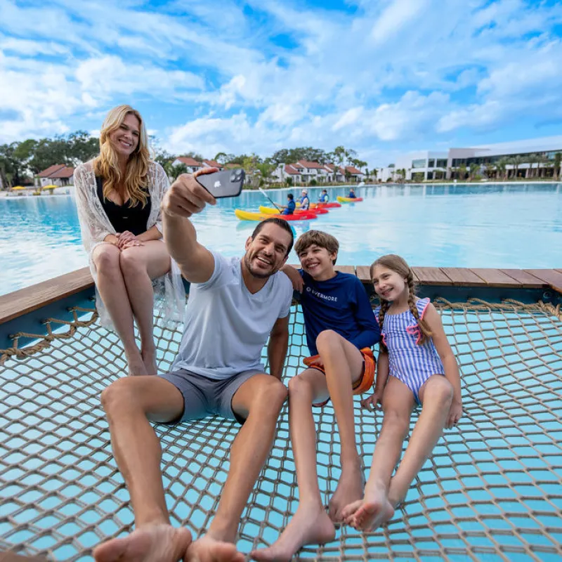 Family taking selfie in cabana