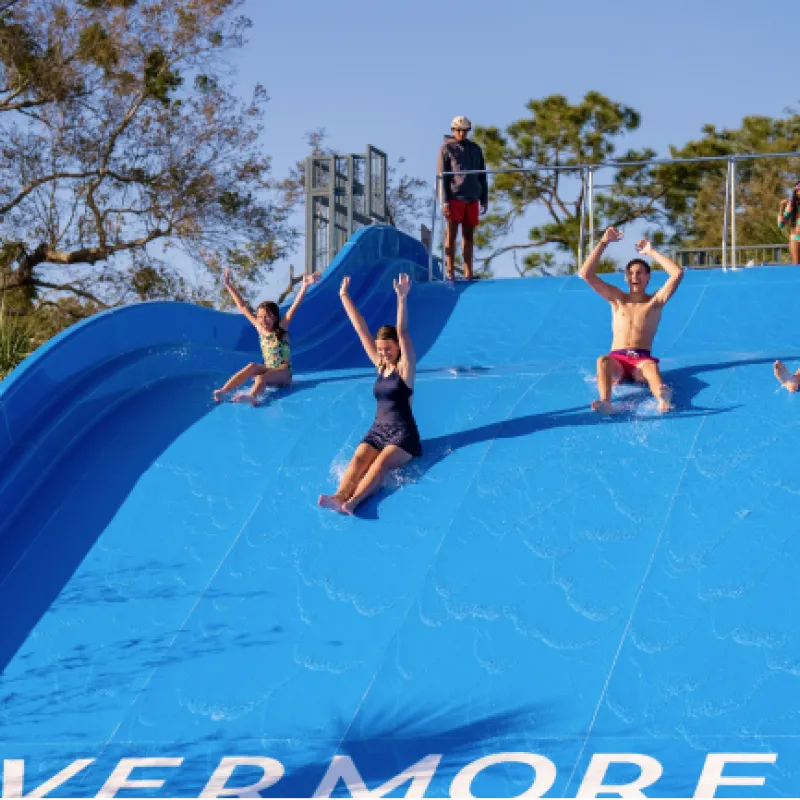 People enjoying the water slide 