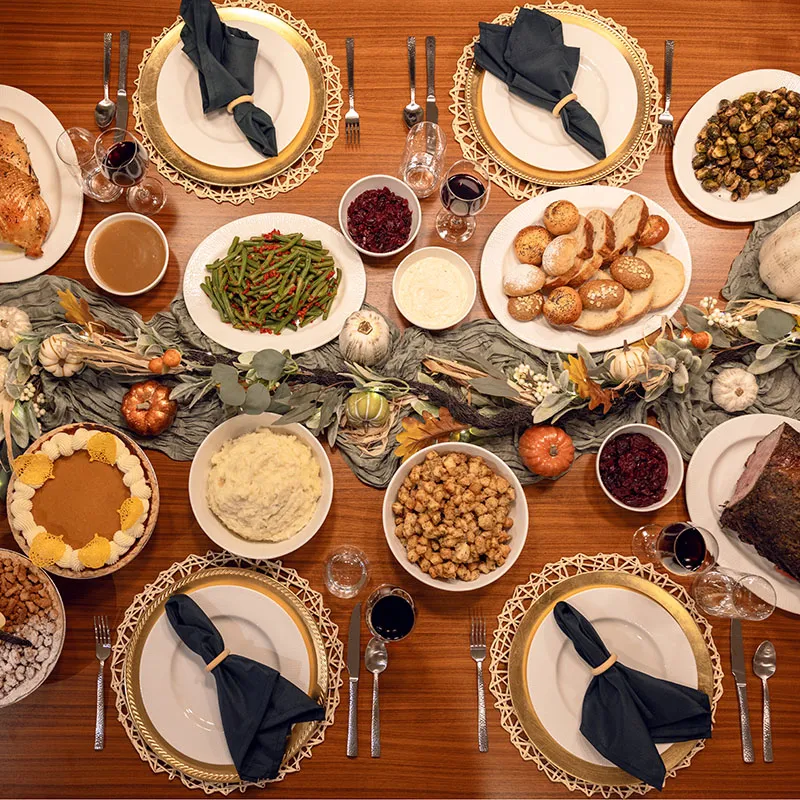 A top-down image of the Evermore To Your Door holiday meal set up on the kitchen table in a house at Evermore Orlando Resort.