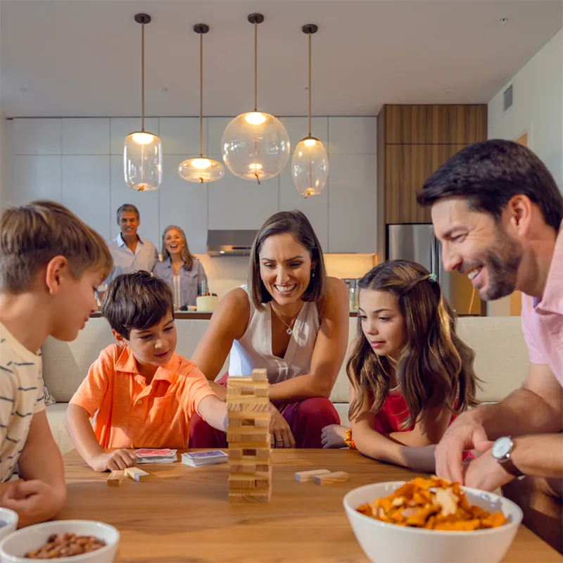 An image of a family playing games together in a Flat at Evermore Orlando Resort.