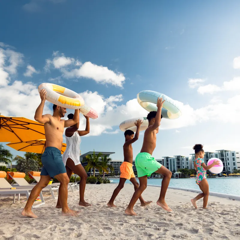 Family running with floaties