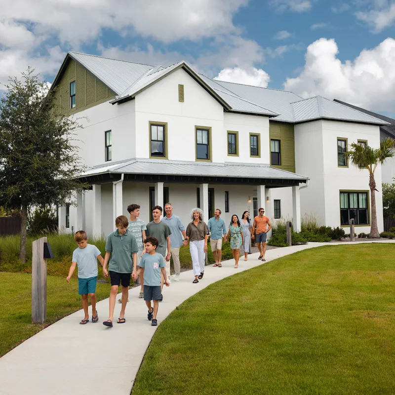 Multi-Generational Family Walking From Their Vacation House Image of a multi-generational family walking from their House at Evermore Orlando Resort.
