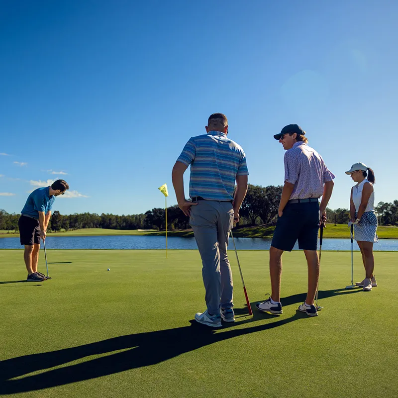 Golf Group on The Cypress Course Image of a group of golfers putting on the Cypress Course of Grand Cypress Golf at Evermore Orlando Resort.
