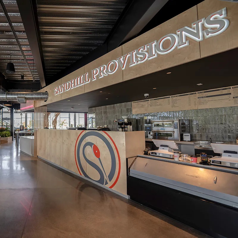 Image of the interior of Sandhill Provisions Coffee and Marketplace inside The Landing at Evermore Orlando Resort.