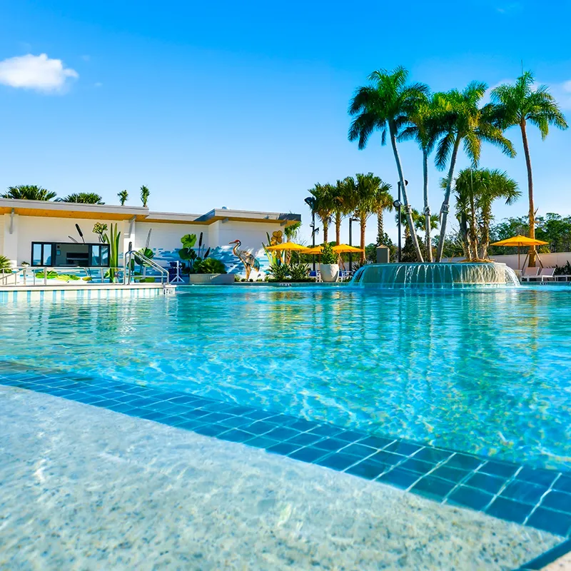 Image of the Boardwalk Pool area and The Deep End casual dining location at Evermore Orlando Resort.