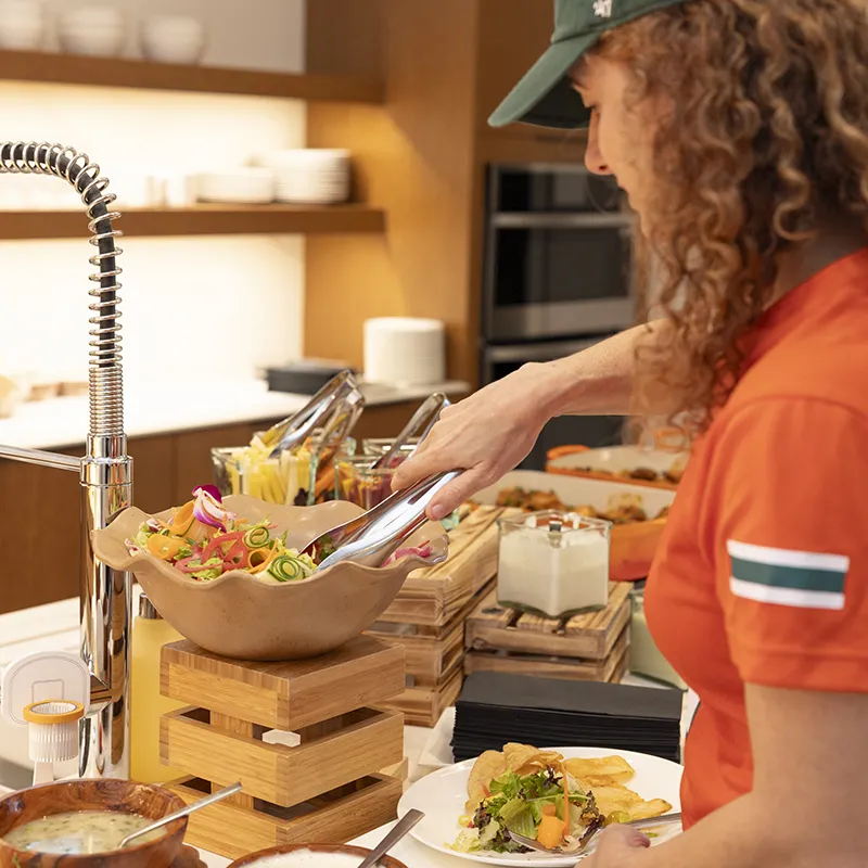 A woman enjoying The Home Advantage signature experience inside her Evermore vacation home.