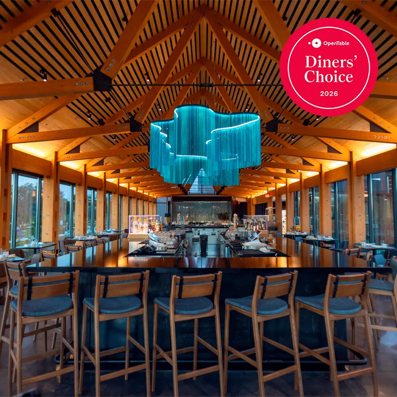 Image of the interior of Twin View Restaurant and Bar at Evermore Orlando Resort with the OpenTable Diners' Choice Award 2026 logo.