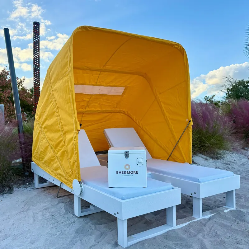 Image of a 2-seater beach daybed in a prime bayside location by Evermore Bay at Evermore Orlando Resort.