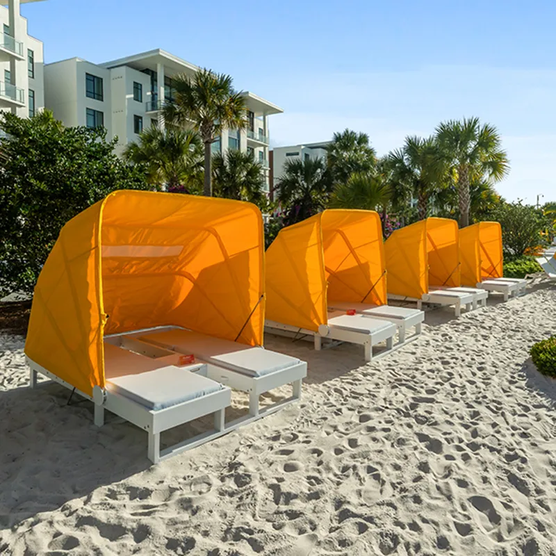 Image of the 2-seater beach daybeds in a prime bayside location by Evermore Bay at Evermore Orlando Resort.