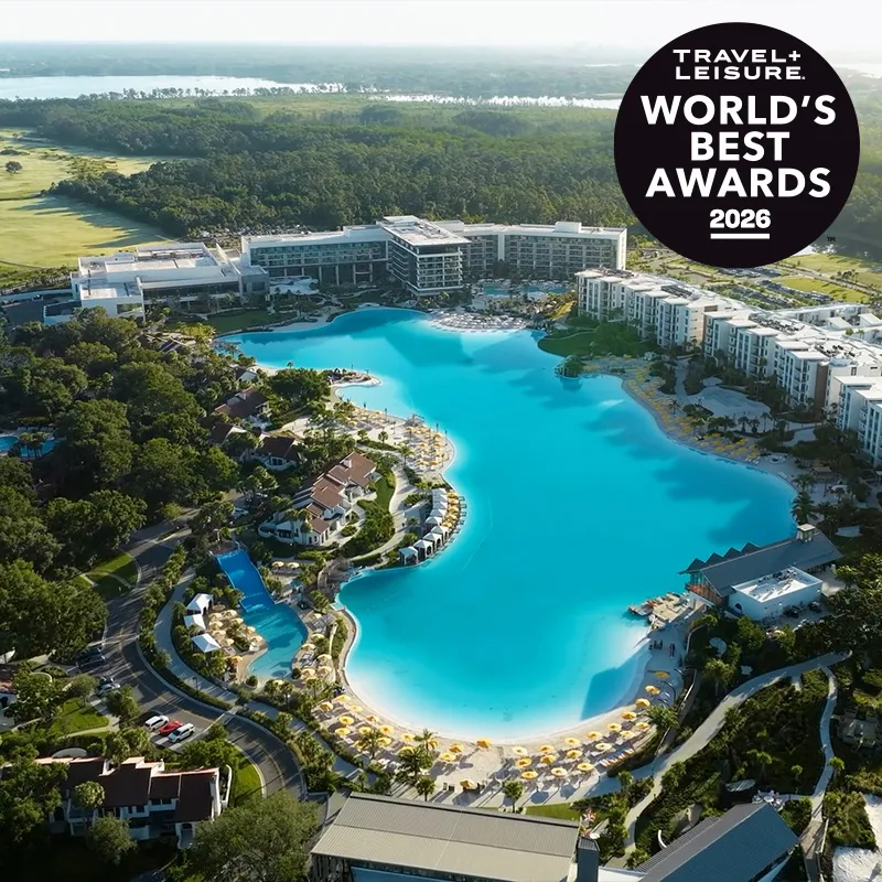 Aerial image of Evermore Bay and the amenities at Evermore Orlando Resort with the Travel + Leisure World's Best Awards 2026 badge.
