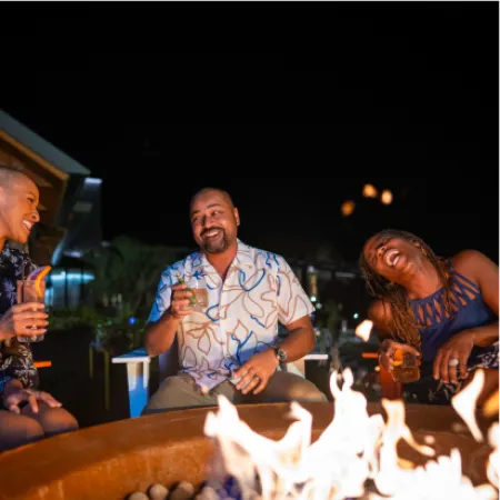 Guests relaxing around fire pit