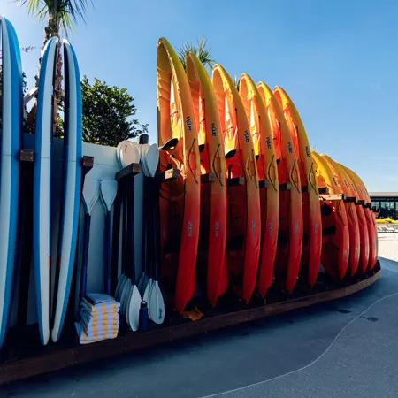 An image of kayaks ready to be used by Evermore Bay at Evermore Orlando Resort.