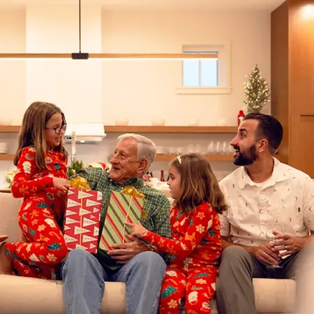 Family sharing presents on the couch