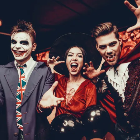 Image of adults dressed in Halloween costumes enjoying a Block Party at Evermore Orlando Resort.