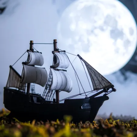 Image of a pirate ship at night.