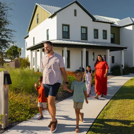 An image of a family walking out in front of an Evermore House.