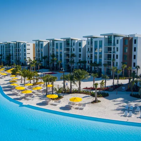 Image of the 5-Story Towers Evermore Bay View Flats on the beach at Evermore Orlando Resort.