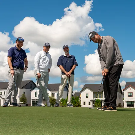 Image of guests and Grand Cypress Golf professional instructors participating in a weekly clinic at Evermore Orlando Resort.